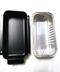 Heavy Duty Aluminum Foil Grill Drip Pans 20 Pack Kickass Grease Catcher Trays Replaces Char Broil Gas Grills 7 X 3.5 X 1.5 Inches, aluminum and black trays side by side.