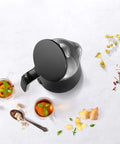 Top view of Enfinigy Cool Touch 1 Liter Electric Kettle Cordless Tea Kettle For Hot Water Black Compact with open lid.