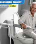 Heavy Duty Flip Up Toilet Grab Bar With Adjustable Length And Height Hella Stable Bathroom Safety Rail For Seniors Support Leg 660 Lb Capacity Anti Slip Handicap Handrail Built Like A Tank Grip mounted beside a toilet, providing support.