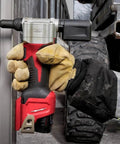 Beefy Cordless Rivet Tool For 12 Volt Power Batteries Pulls Aluminum Steel And Stainless Fasteners With Zero Sweat Pro Level Electric Riveter Smooth Operator For Heavy Duty Shop Work in use with gloved hand.