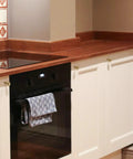Champagne Bronze Cabinet Knobs 2 Pack Round Drawer Knobs on white kitchen cabinets with wood countertop