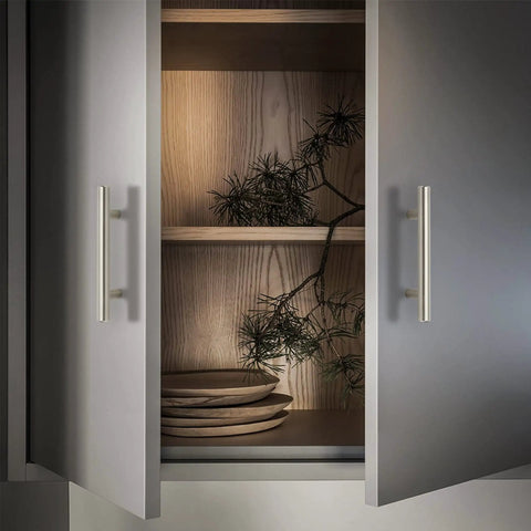 Upgrade Your Kitchen Game With These Smooth Brushed Nickel Cabinet Pull Handles featuring modern design on cabinet doors.