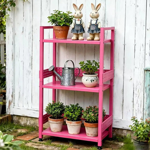 Rolling 3 Tier Metal Storage Organizer With Soft Pink Finish And Adjustable Foot Pads For Squishy Spaces Featuring Pop Off Guard Panels To Knock Kitchen Laundry And Garage Jumble Down Easy For Stress Free Home Upkeep Anywhere You Park It with plants and decor.