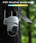 2K Wireless Outdoor Security Camera System With Solar Panel And Battery Power, mounted on tree, showing weather resistance.