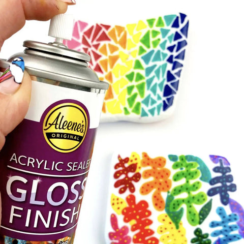 Spray Gloss Finish Acrylic Sealer 6 Oz Clear Coat For DIY Indoor And Outdoor Projects in use over colorful patterns