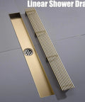 Rectangular Shower Drain with Hair Strainer and Stainless Steel Grate for Bathroom Floor Featuring Linear Design shown from above.