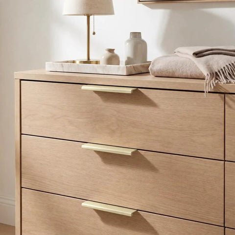 10 Pack Slick Brushed Gold Finger Edge Drawer Pulls Featuring Smooth Hidden Grip And Heavy Duty Zinc Construction For Quick Cabinetry Makeover Includes All Mounting Hardware For Fast Setup on wooden dresser.
