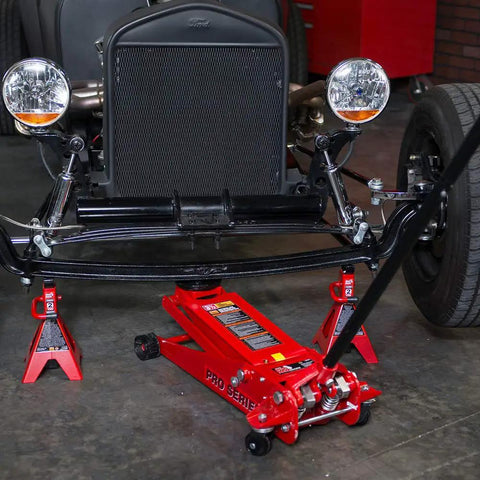 Heavy Duty Hydraulic Low Profile Floor Jack With Dual Piston Quick Lift Pump And 3.5 Ton 7000 Lb Capacity under a classic car.