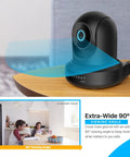 4MP ProHD Indoor WiFi Security IP Camera With Pan Tilt And Two Way Audio Night Vision Remote Viewing 90 Degree Wide Field Of View H265 30FPS Works With Alexa Cloud IP4M 1041B Black on wooden table showing 90-degree wide view angle.