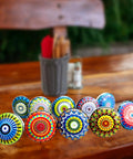 Ceramic Cabinet Knobs Set With Vintage Look Hand Painted Multicolor Mandala Designs For Doors, Wardrobes, Kitchen Cabinets, Drawers, Dresser, And Cupboards Pulls That Rad Upgrade For Your Space displayed on a wooden surface