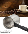 Electric Turkish Coffee And Tea Maker 600ml Capacity 600W Stainless Steel Pot With Anti Scald Handle shown with coffee beans.