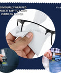 Lens cleaner spray kit with 10 microfiber cloths; hand wiping eyeglasses; spray bottle labeled Lens Cleaner.