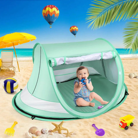 Baby sitting inside Large Pop Up Baby Beach Tent With Mosquito Net Portable Sun Shade For Travel And Indoor Play Kid Friendly Easy Setup Spacious 54 By 35 By 26 Inch Design UPF 50 Plus UV Protection No Fuss Portable Shelter