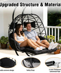 Couple relaxing on Two Person Outdoor Double Egg Chair With Stand And Adjustable Canopy For Patio And Garden Extra Large Hanging Chair