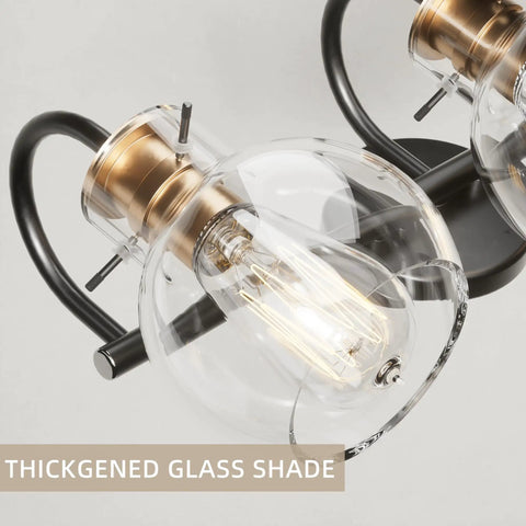 Three Light Vanity Light Fixture In Black And Copper With Globe Glass Shade, close-up of thickened glass and metal base
