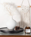 Premium Wood Lazy Susan Turntable Functions As Slick Kitchen Game Changer With Smooth Swivel Glide Waterproof 11 Inch Black Round Serving Tray on display with vase and candle.