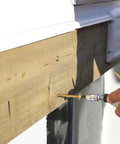 Rugged Structural Framing Screws One Quarter Inch By Three In Eighteen Inches Pack Of Fifty Heavy Duty Lag Screw Alternative in use with power tool on wooden beam.