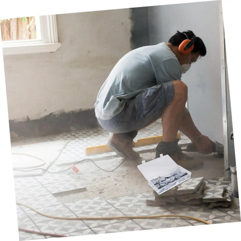 Worker using tools with Heavy Duty Toggle Bolt And Wing Nut Kit for drywall, 48 piece set visible on floor.