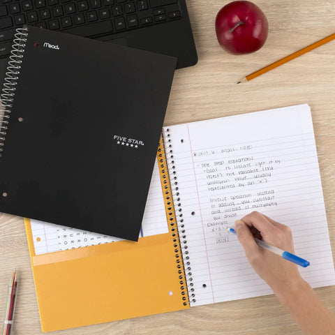 Hustle Ready Black Spiral Notebook With Five Subject Sections And College Ruled Paper Providing Clean Lines And No Bleed Pages Built For Daily Study Grinds And Phone Pairing on wooden desk with pencil and apple.