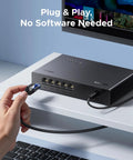 Five Port 2.5Gb Ethernet Switch with five 2.5Gb ports, shown in use on a desk setup, featuring plug and play unmanaged network connectivity.