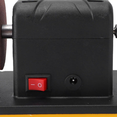 Hustle Ready Cordless Mini Bench Grinder Featuring Dual 3 Inch Grinding Wheels, close-up of power switch and motor design.