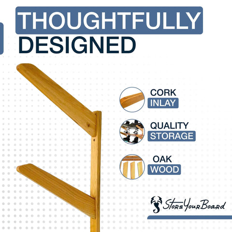 Premium Heavy Duty Solid American Oak Snowboard Wall Rack Holds Three Boards Securely with Extra Stash Zone for Helmets Goggles and Ski Poles for Your Garage or Man Cave Flex Display showing solid oak construction and cork inlay.