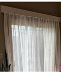 Heavy Duty Ceiling Curtain Track System With Smooth Silent Pulleys And Double Aluminum Runners Paired With A Slick Cornice Cover For Total Blackout and sheer curtains.