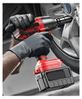 Super Charged Cordless Brushless Impact Wrench With High Torque For Car Repair And Home Projects in use on a wheel.