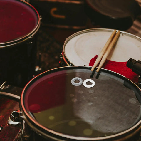Heavy Duty Metal Wedge Locking Washers For Drum Rack Mounting Hardware and Cymbal Stand Secure Fasteners on drum surface.
