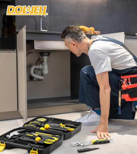 Compact 10 Piece Small Tool Kit Set With Portable Plastic Storage Case for Home Repairs visible next to a man fixing plumbing