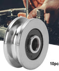 Rock Solid Ten Pack Of TV0418 V Groove Ball Bearings 4 X 18 X 8 mm Precision Steel Track Roller Guide Rail For Motors Toys And Fitness Gear Built Tough For Heavy Duty Jobs close-up of V groove ball bearing on workshop background.