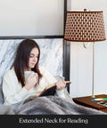 Person reading beside Madison Side Table With Built In Lamp, Wireless Charging Pad And USB Port in bedroom setting.