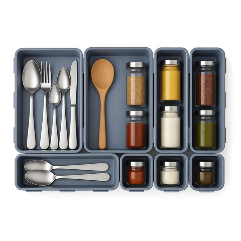 8 Piece Interlocking Drawer Organizer Trays Set In Light Gray Plastic with utensils and spices in kitchen drawer