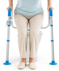 Dead Nuts Solid Heavy Duty Aluminum Toilet Safety Rails With No Shift Grip Pads And Beefy Handle Bars Made Super Tough To Back Up Seniors Up To Three Hundred Fifty Pounds At Home, user sitting on toilet with safety rails.
