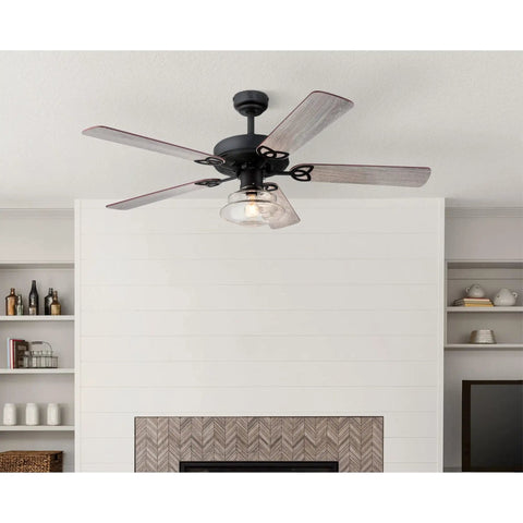 Vintage Style LED Ceiling Fan With Light, 52 Inch Matte Black Ceiling Fan With Clear Glass Schoolhouse Shade in a living room