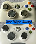Two white Xbox 360 controllers, front views, worn thumbsticks and D-pads, blue One Wipe Away banner