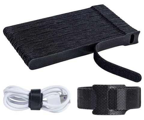 Black stack of 120 Pack Reusable 6 Inch Hook And Loop Cable Ties with one tie securing a white USB cable, ideal for cable management.