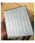 Person holding BLED6C Motor Controller Industrial Motion Drive for Automation Equipment. Metal casing and connectors visible.