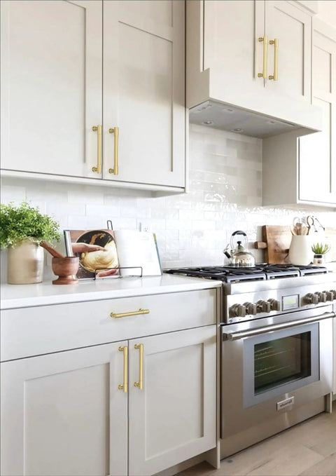 10 Pack Brushed Gold Cabinet Pulls Serving Up Swank Modern Charm 5 Inch Wide Set in stylish kitchen cabinetry.