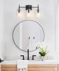 Three Light Black Vanity Light Fixture Over Mirror With Clear Glass Shades For Sleek Modern Bathroom E26 Bulb Compatible