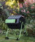 Hotfrog Dual Chamber Tumbling Composter On Wheels For No Fuss Easy Turning 37 Gallon Outdoor Garden Bin in a garden