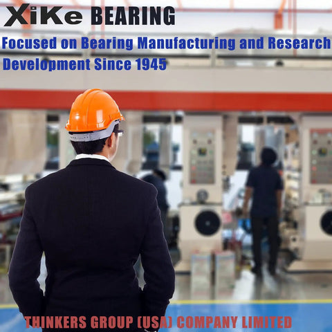 Individual in suit and safety helmet in bearing manufacturing facility, showcasing machinery and work environment.