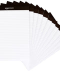 Wide Ruled Lined Writing Note Pads 12 Pack With 50 Perforated Sheets Each Letter Size White Paper And Sturdy Chipboard Backing on a desk.