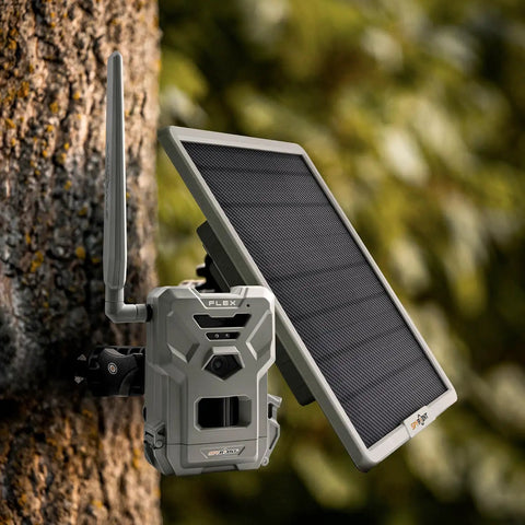 All In One Solar Panel For Trail Cameras With Built In Lithium Battery And Plug And Play Setup, mounted on tree.
