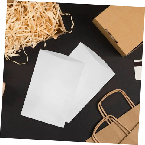 Straight Up Epe Foam Expandable Packing Sleeves In A 100 Piece Lot, white foam bags on black surface for packing dishes.