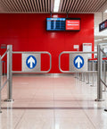 Heavy Duty Automatic Swing Gate With Quick Close Tech For Secure Entry And Exit Control Polished Stainless Steel Safety Barrier in indoor setting.