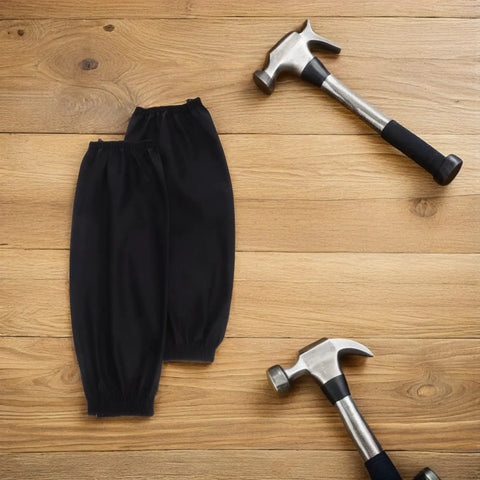 Premium Two Pack Waterproof Polyurethane Arm Sleeves with hammers on wood surface, ideal for kitchen and auto shop use.