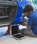Boss Grade Aluminum Alloy Toolbox Featuring Secure Locking Panel And Portable Tool Stash Hella Tough For Hardworking Crews And DIY Enthusiasts at a car repair.