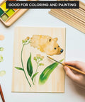 Unfinished Balsa Wood Sheets And Dowel Rods Craft Kit with a hand painting leaves and animal on a basswood sheet, paint and brushes visible