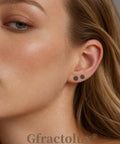 Flat Back Titanium Tiny Dot Earrings For Sensitive Ears Hypoallergenic G23 Implant Grade Studs worn by a model showing 3mm black dots.
